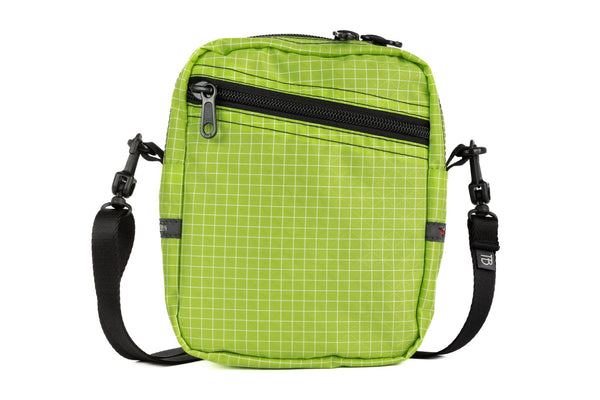 Front photo of an Everyday Cubelet in Kiwi Halcyon (bright green with a white grid) with a front zipper.